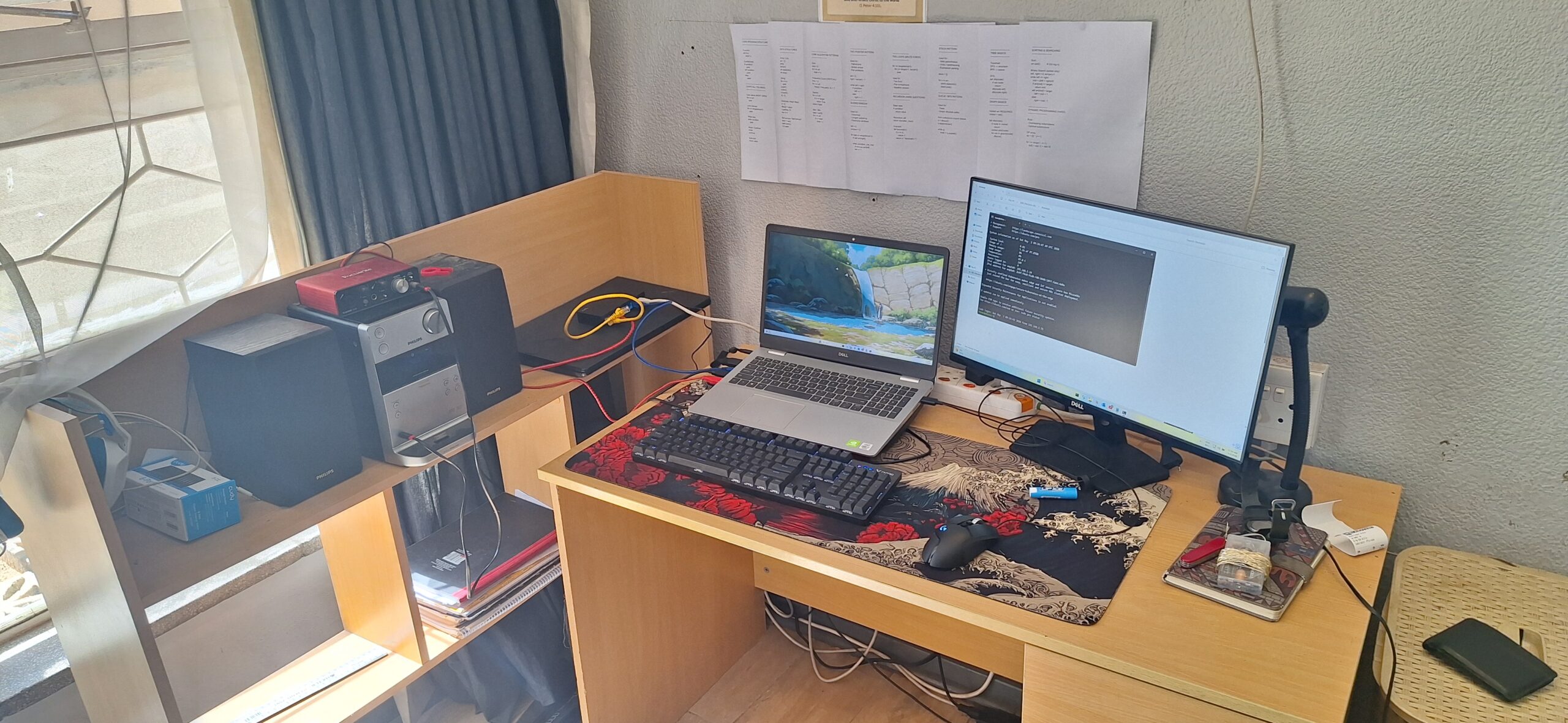 Full desk setup — Ginrou open, external monitor, keyboard, the homelab running