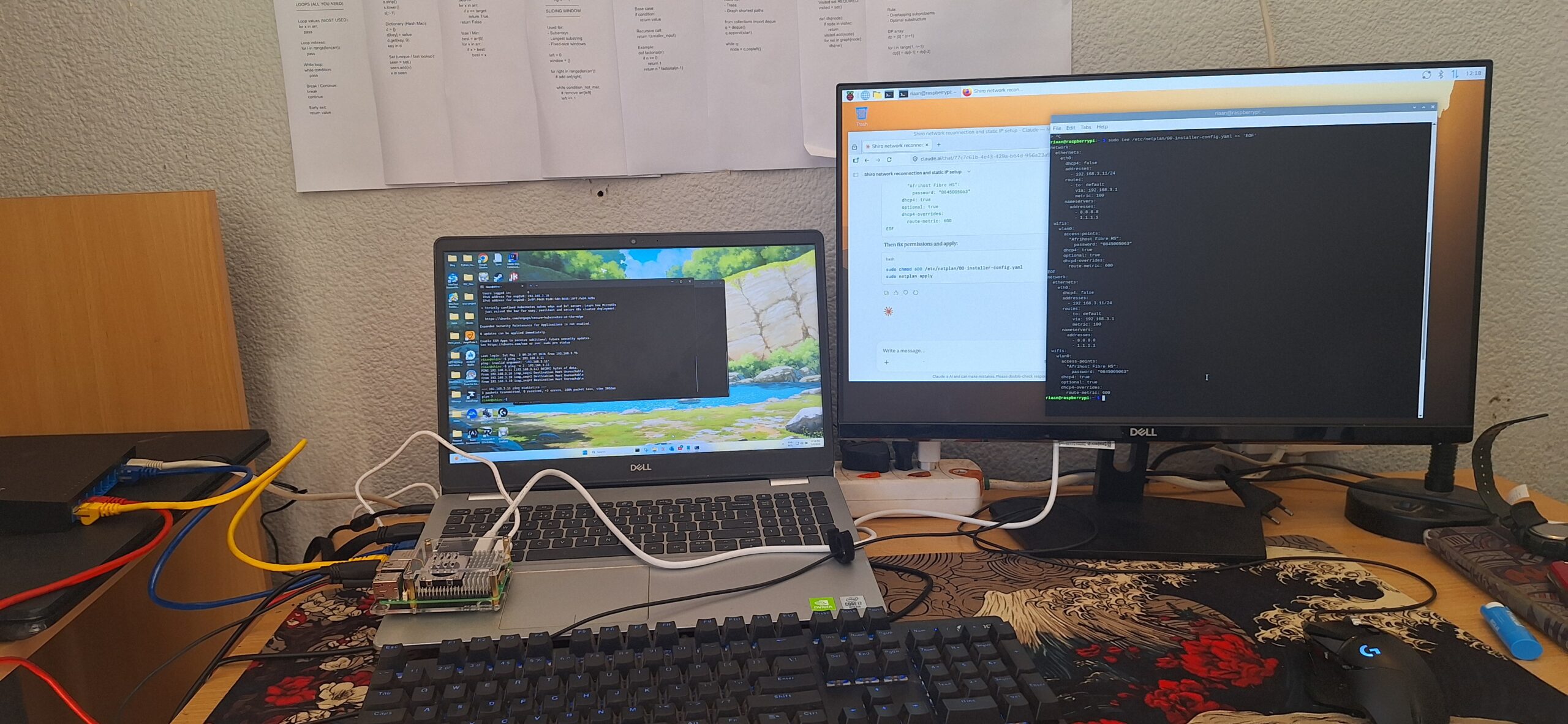 Ginrou with Ryuu Pi5 in front, external monitor showing terminals, Python notes on the wall